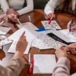 close-up of many diagrams and business plans written on sheets of paper during business meeting